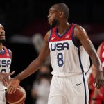 
              United States' Damian Lillard (6), left, and Khris Middleton (8) celebrate at the end of first quarter during men's basketball preliminary round game against Iran at the 2020 Summer Olympics, Wednesday, July 28, 2021, in Saitama, Japan. (AP Photo/Charlie Neibergall)
            