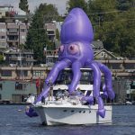 Fans watch the Seattle Kraken expansion draft from Lake Union. (AP)