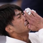 
              Yang Yung-wei, of Taiwan, reacts after his loss to Naohisa Takato, of Japan, in a men's 60kg judo gold medal match at the 2020 Summer Olympics, Saturday, July 24, 2021, in Tokyo. (AP Photo/Jae C. Hong)
            