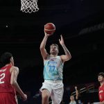 
              Slovenia's Luka Doncic (77) drives to the against Japan's Yuta Watanabe (12), left, during men's basketball preliminary round game at the 2020 Summer Olympics, Thursday, July 29, 2021, in Saitama, Japan. (AP Photo/Eric Gay)
            