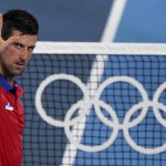 
              Novak Djokovic, of Serbia, celebrates after defeating Kei Nishikori, of Japan, during the quarterfinals of the tennis competition at the 2020 Summer Olympics, Thursday, July 29, 2021, in Tokyo, Japan. (AP Photo/Seth Wenig)
            