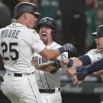 Dylan Moore's grand slam capped a Mariners comeback from seven runs down in their 11-8 win over the Astros. (AP)