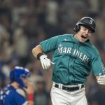 SEATTLE, WA -  AUGUST 13: Jarred Kelenic #10 of the Seattle Mariners celebrates a walk off walk after a game against the Toronto Blue Jays at T-Mobile Park on August 13, 2021 in Seattle, Washington. The Mariners won 3-2. (Photo by Stephen Brashear/Getty Images)