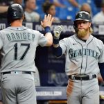 ST PETERSBURG, FLORIDA - AUGUST 02: Mitch Haniger #17 celebrates with Jake Fraley #28 of the Seattle Mariners after scoring in the third inning against the Tampa Bay Rays at Tropicana Field on August 02, 2021 in St Petersburg, Florida. (Photo by Julio Aguilar/Getty Images)