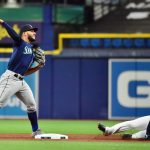 ST PETERSBURG, FLORIDA - AUGUST 03: Abraham Toro #13 of the Seattle Mariners turns a double play in the first inning against the Tampa Bay Rays at Tropicana Field on August 03, 2021 in St Petersburg, Florida. (Photo by Julio Aguilar/Getty Images)