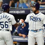 ST PETERSBURG, FLORIDA - AUGUST 03: Randy Arozarena #56 celebrates with Nelson Cruz #23 of the Tampa Bay Rays after hitting a home run in the first inning against the Seattle Mariners at Tropicana Field on August 03, 2021 in St Petersburg, Florida. (Photo by Julio Aguilar/Getty Images)