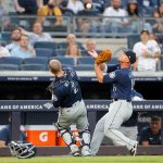 NEW YORK, NEW YORK - AUGUST 05:  Kyle Seager #15 of the Seattle Mariners makes a catch for an out in the second inning against the New York Yankees as he tries to avoid teammate Tom Murphy #2 at Yankee Stadium on August 05, 2021 in New York City. (Photo by Jim McIsaac/Getty Images)