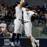 NEW YORK, NEW YORK - AUGUST 05:  Joey Gallo #13 of the New York Yankees celebrates his seventh inning three run home run against the Seattle Mariners with teammate Giancarlo Stanton #27 at Yankee Stadium on August 05, 2021 in New York City. (Photo by Jim McIsaac/Getty Images)