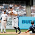 NEW YORK, NEW YORK - AUGUST 08:  DJ LeMahieu #26 of the New York Yankees completes a sixth inning double play after forcing out Kyle Seager #15 of the Seattle Mariners at Yankee Stadium on August 08, 2021 in New York City. (Photo by Jim McIsaac/Getty Images)