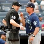 NEW YORK, NEW YORK - AUGUST 08:  Manager Scott Servais #9 of the Seattle Mariners argues with home plate umpire Lance Barrett during the eighth inning of a game against the New York Yankees at Yankee Stadium on August 08, 2021 in New York City. (Photo by Jim McIsaac/Getty Images)