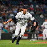 SEATTLE, WASHINGTON - AUGUST 10: Logan Gilbert #36 of the Seattle Mariners tosses the ball to first base for an out during the fifth inning of the game against the Texas Rangers at T-Mobile Park on August 10, 2021 in Seattle, Washington. (Photo by Alika Jenner/Getty Images)