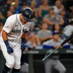 SEATTLE, WASHINGTON - AUGUST 10: Dylan Moore #25 of the Seattle Mariners reacts to a pop fly in the fifth inning of the game against the Texas Rangers at T-Mobile Park on August 10, 2021 in Seattle, Washington. (Photo by Alika Jenner/Getty Images)