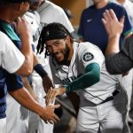 SEATTLE, WASHINGTON - AUGUST 11: J.P. Crawford #3 of the Seattle Mariners celebrates with teammates after scoring in the sixth inning against the Texas Rangers at T-Mobile Park on August 11, 2021 in Seattle, Washington. (Photo by Alika Jenner/Getty Images)