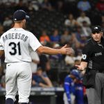 SEATTLE, WASHINGTON - AUGUST 11:  PItcher Tyler Anderson #31 of the Seattle Mariners disagrees with a call by home plate umpire Mark Ripperger #90 in the sixth inning against the Texas Rangers at T-Mobile Park on August 11, 2021 in Seattle, Washington. (Photo by Alika Jenner/Getty Images)