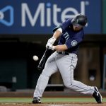 ARLINGTON, TEXAS - AUGUST 18: Kyle Seager #15 of the Seattle Mariners hits a two-run home run against the Texas Rangers in the top of the first inning at Globe Life Field on August 18, 2021 in Arlington, Texas. (Photo by Tom Pennington/Getty Images)