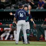 ARLINGTON, TEXAS - AUGUST 18: Drew Steckenrider #16 of the Seattle Mariners celebrates with Cal Raleigh #29 of the Seattle Mariners after the Seattle Mariners beat the Texas Rangers 3-1 at Globe Life Field on August 18, 2021 in Arlington, Texas. (Photo by Tom Pennington/Getty Images)