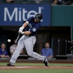 ARLINGTON, TEXAS - AUGUST 19: Kyle Seager #15 of the Seattle Mariners hits a RBI double against the Texas Rangers in the top of the first inning at Globe Life Field on August 19, 2021 in Arlington, Texas. (Photo by Tom Pennington/Getty Images)