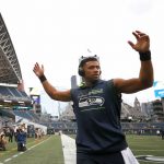 SEATTLE, WASHINGTON - AUGUST 21: Quarterback Russell Wilson #3 of the Seattle Seahawks hypes up the crowd before an NFL preseason game against the Denver Broncos at Lumen Field on August 21, 2021 in Seattle, Washington. (Photo by Steph Chambers/Getty Images)