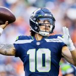 SEATTLE, WASHINGTON - AUGUST 21: Quarterback Alex McGough #10 of the Seattle Seahawks passes in the first quarter during an NFL preseason game against the Denver Broncos at Lumen Field on August 21, 2021 in Seattle, Washington. (Photo by Steph Chambers/Getty Images)