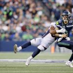 SEATTLE, WASHINGTON - AUGUST 21: Quarterback Alex McGough #10 of the Seattle Seahawks is sacked by linebacker Jonathon Cooper #53 of the Denver Broncos in the first half during an NFL preseason game at Lumen Field on August 21, 2021 in Seattle, Washington. (Photo by Steph Chambers/Getty Images)