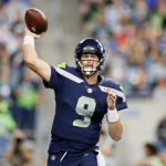 SEATTLE, WASHINGTON - AUGUST 21: Quarterback Sean Mannion of the Seattle Seahawks looks to pass in the second half during an NFL preseason game against the Denver Broncos at Lumen Field on August 21, 2021 in Seattle, Washington. (Photo by Steph Chambers/Getty Images)