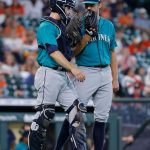 HOUSTON, TEXAS - AUGUST 22: Tom Murphy #2 of the Seattle Mariners talks to pitcher Tyler Anderson #31 in the third inning against the Houston Astros at Minute Maid Park on August 22, 2021 in Houston, Texas. (Photo by Bob Levey/Getty Images)