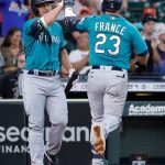 HOUSTON, TEXAS - AUGUST 22: Ty France #23 of the Seattle Mariners high fives Kyle Seager after hitting a home run in the ninth inning against the Houston Astros at Minute Maid Park on August 22, 2021 in Houston, Texas. (Photo by Bob Levey/Getty Images)