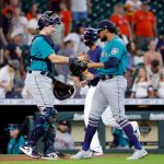 HOUSTON, TEXAS - AUGUST 22: Yohan Ramirez #55 and catcher Cal Raleigh #29 of the Seattle Mariners celebrate after defeating the Houston Astros 6-3 in 11 innings at Minute Maid Park on August 22, 2021 in Houston, Texas. (Photo by Bob Levey/Getty Images)