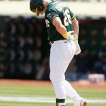 OAKLAND, CALIFORNIA - AUGUST 24: Matt Chapman #26 of the Oakland Athletics reacts after being hit by a pitch in the bottom of the fourth inning against the Seattle Mariners at RingCentral Coliseum on August 24, 2021 in Oakland, California. (Photo by Lachlan Cunningham/Getty Images)