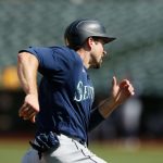 OAKLAND, CALIFORNIA - AUGUST 24: Tom Murphy #2 of the Seattle Mariners rounds the bases to score on a double by Jarred Kelenic #10 in the top of the eighth inning against the Oakland Athletics at RingCentral Coliseum on August 24, 2021 in Oakland, California. (Photo by Lachlan Cunningham/Getty Images)