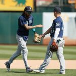 OAKLAND, CALIFORNIA - AUGUST 24: Seattle Mariners players J.P. Crawford #3 and Ty France #23 celebrate after a win against the Oakland Athletics at RingCentral Coliseum on August 24, 2021 in Oakland, California. (Photo by Lachlan Cunningham/Getty Images)