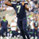 SEATTLE, WASHINGTON - AUGUST 28: Geno Smith #7 of the Seattle Seahawks looks to throw the ball against the Los Angeles Chargers in the first quarter during the NFL preseason game at Lumen Field on August 28, 2021 in Seattle, Washington. (Photo by Abbie Parr/Getty Images)