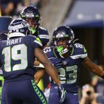 SEATTLE, WASHINGTON - AUGUST 28: Darece Roberson Jr #83 of the Seattle Seahawks celebrates after scoring a touchdown against the Los Angeles Chargers in the fourth quarter during the NFL preseason game at Lumen Field on August 28, 2021 in Seattle, Washington. (Photo by Abbie Parr/Getty Images)