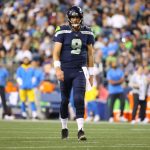 SEATTLE, WASHINGTON - AUGUST 28: Sean Mannion #9 of the Seattle Seahawks reacts against the Los Angeles Chargers in the fourth quarter during the NFL preseason game at Lumen Field on August 28, 2021 in Seattle, Washington. (Photo by Abbie Parr/Getty Images)