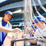 SEATTLE, WASHINGTON - AUGUST 29: Chris Flexen #77 of the Seattle Mariners signs autographs before the game against the Kansas City Royals at T-Mobile Park on August 29, 2021 in Seattle, Washington. (Photo by Steph Chambers/Getty Images)