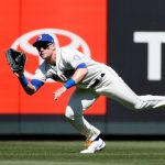 SEATTLE, WASHINGTON - AUGUST 29: Jarred Kelenic #10 of the Seattle Mariners makes a diving catch for an out during the second inning against the Kansas City Royals at T-Mobile Park on August 29, 2021 in Seattle, Washington. (Photo by Steph Chambers/Getty Images)