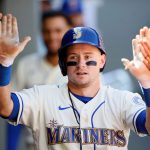 SEATTLE, WASHINGTON - AUGUST 29: Jarred Kelenic #10 of the Seattle Mariners celebrates in the dugout after his home run during the sixth inning against the Kansas City Royals at T-Mobile Park on August 29, 2021 in Seattle, Washington. (Photo by Steph Chambers/Getty Images)