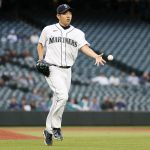 SEATTLE, WASHINGTON - AUGUST 31: Yusei Kikuchi #18 of the Seattle Mariners tosses to first base for the out against Jose Altuve of the Houston Astros during the first inning at T-Mobile Park on August 31, 2021 in Seattle, Washington. (Photo by Steph Chambers/Getty Images)