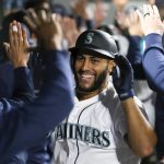 SEATTLE, WASHINGTON - AUGUST 31: Abraham Toro #13 of the Seattle Mariners reacts after his grand slam home run during the eighth inning against the Houston Astros at T-Mobile Park on August 31, 2021 in Seattle, Washington. (Photo by Steph Chambers/Getty Images)