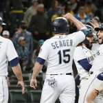 SEATTLE, WASHINGTON - AUGUST 31: Abraham Toro #13 of the Seattle Mariners reacts after his grand slam home run with Ty France #23, Kyle Seager #15 and J.P. Crawford #3 during the eighth inning against the Houston Astros at T-Mobile Park on August 31, 2021 in Seattle, Washington. (Photo by Steph Chambers/Getty Images)