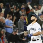SEATTLE, WASHINGTON - AUGUST 31: Abraham Toro #13 of the Seattle Mariners reacts after his grand slam home run during the eighth inning against the Houston Astros at T-Mobile Park on August 31, 2021 in Seattle, Washington. (Photo by Steph Chambers/Getty Images)