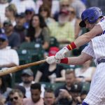 
              Chicago Cubs' Patrick Wisdom hits a three-run home run during the fifth inning in the first baseball game of a doubleheader against the Colorado Rockies in Chicago, Wednesday, Aug. 25, 2021. (AP Photo/Nam Y. Huh)
            