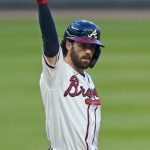 
              Atlanta Braves shortstop Dansby Swanson (7) gestures after hitting a two-run double in the first inning of a baseball game against the New York Yankees Tuesday, Aug. 24, 2021, in Atlanta. (AP Photo/John Bazemore)
            