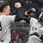 
              New York Yankees second baseman Rougned Odor (12) celebrates with Aaron Judge (99) after hitting a solo home run in the seventh inning of a baseball game against the Atlanta Braves Tuesday, Aug. 24, 2021, in Atlanta. (AP Photo/John Bazemore)
            