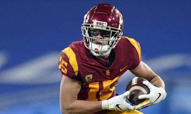FILE - In this Dec 12, 2020, file photo, Southern California wide receiver Drake London (15) runs t...