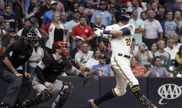 Milwaukee Brewers' Christian Yelich hits an RBI sacrifice fly during the seventh inning of a baseba...
