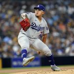 
              Los Angeles Dodgers starting pitcher Julio Urias works against a San Diego Padres batter during the first inning of a baseball game Tuesday, Aug. 24, 2021, in San Diego. (AP Photo/Gregory Bull)
            