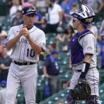 
              Colorado Rockies manager Bud Black, left, talks with catcher Dom Nunez as they wait for relief pitcher Tyler Kinley after Chicago Cubs' Patrick Wisdom hit a three-run home run during the fifth inning in the first baseball game of a doubleheader in Chicago, Wednesday, Aug. 25, 2021. (AP Photo/Nam Y. Huh)
            