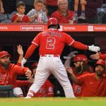 ANAHEIM, CA - SEPTEMBER 25:  Luis Rengifo #2 of the Los Angeles Angels is congratulated by team mates after hitting a home run against the Seattle Mariners in the second inning at Angel Stadium of Anaheim on September 25, 2021 in Anaheim, California. (Photo by John McCoy/Getty Images)