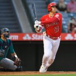 ANAHEIM, CA - SEPTEMBER 25: Cal Raleigh #29 of the Seattle Mariners looks on as Shohei Ohtani #17 of the Los Angeles Angels hits an RBI triple in the first inning at Angel Stadium of Anaheim on September 25, 2021 in Anaheim, California. (Photo by John McCoy/Getty Images)